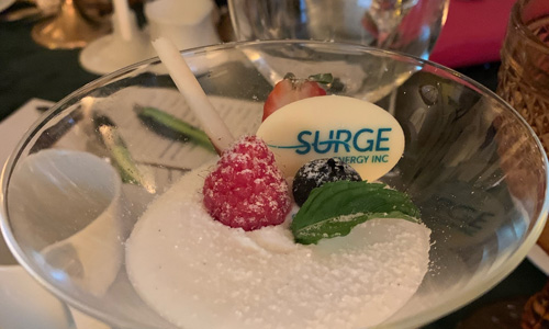 Dessert in martini glass with branded Surge Energy element